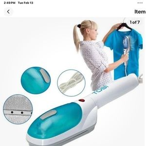 Hand held clothes steamer